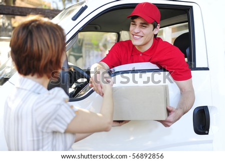 happy postal delivery courier in a van delivering package and handshake