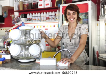 small business: happy waitress selling candy