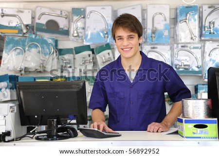 portrait of a sales assistant behind the counter of a building  center