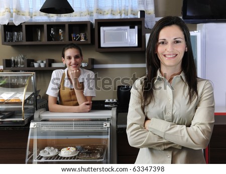 portrait of a happy owner of a cafe or waitress