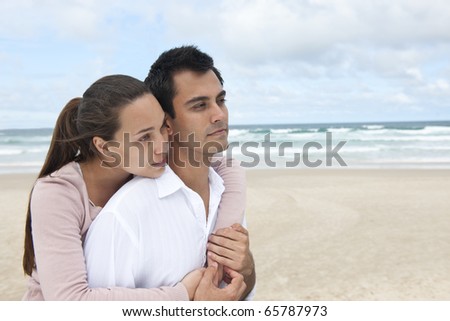 romance on vacation: couple in love on the beach