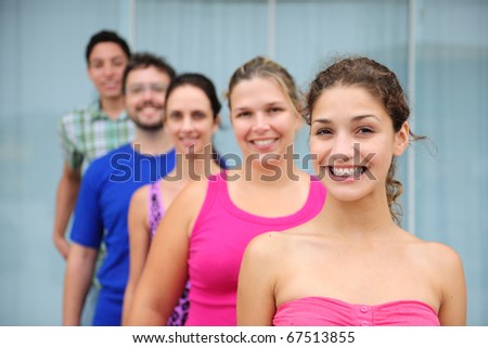 happy and diverse group of casual real people, teenage girl in front
