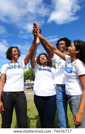 African american volunteer group giving high five