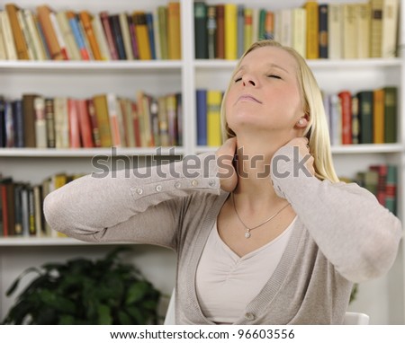 Portrait of young woman suffering from severe neck pain