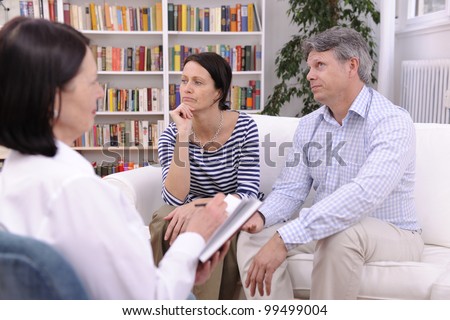 married couple consults talking to psychologist