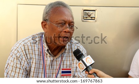 BANGKOK - JANUARY 5 2014: Suthep, leader of the anti government protests stops for an interview at Democracy Monument in Bangkok, Thailand