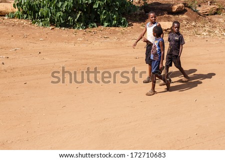 ZAMBIA - OCTOBER 14 2013: Local kid go about day to day life in Zambia, Africa