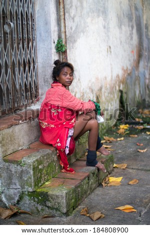 PENANG - MALAYSIA - APRIL 5 2013: Homeless woman in Alleyway of Georgetown, Penang (World Heritage Town) in Malaysia