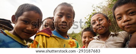 CHIN STATE, MYANMAR - JUNE 16 2015: Children play in the street of a village in the recently opened to foreigners area of Chin State - western Myanmar (Burma)