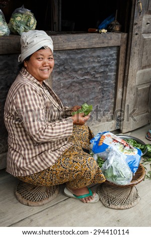 CHIN STATE, MYANMAR - JUNE 23 2015: Preparing vegetables in village in the recently opened to foreigners area of Chin State - western Myanmar (Burma)