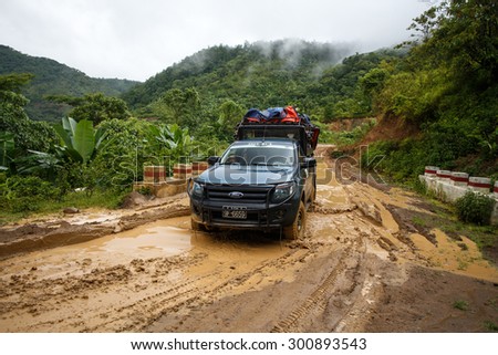 CHIN STATE, MYANMAR - JUNE 22 2015: Offroad Adventure on Dirt Road Leading Through Chin State Mountainous Region, Myanmar (Burma)