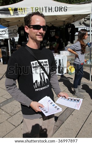 VANCOUVER - SEPT 11: An unidentified person distributes reading materials object at 9/11 Truth Demonstration at Vancouver Art Gallery, September 11, 2009 in Vancouver, Canada