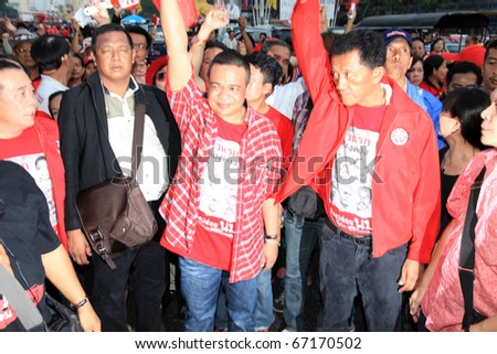 BANGKOK - DEC 10: Jatuporn Prompun - MP, Politician and Red Shirts Leader, greets at least 10,000 anti-government protesters at Democracy Monument on December 10, 2010 in Bangkok