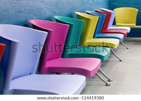 Colorful chairs lined up in a school child