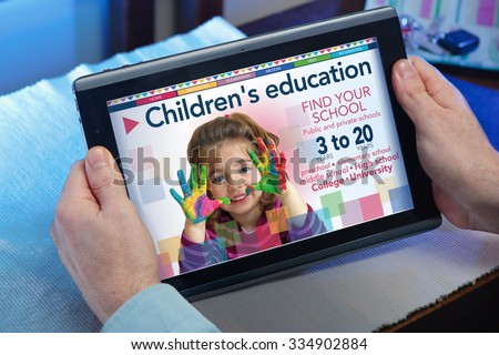 man searching website internet a school center for education with tablet in you home / hands of a man at a website finding a school at house