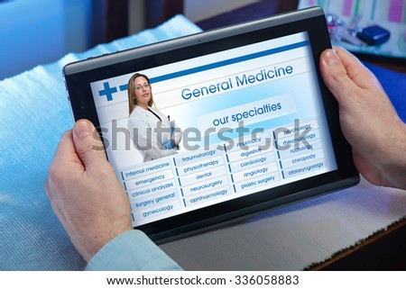 man searching web internet for recruitment health insurance on internet with tablet in you home / hands of a man looking website of health service in the tablet