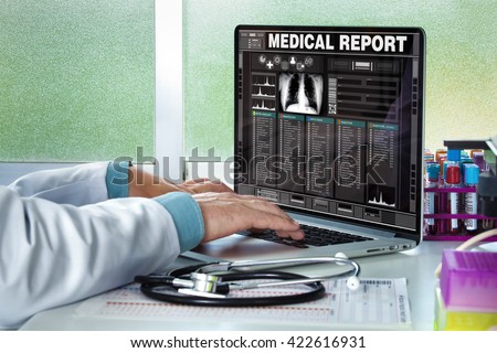physician in consultation with a medical record of a patient on the screen of the laptop / Doctor consulting a medical history on a computer