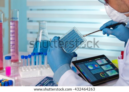 scientist working in a pharmaceutical lab / biochemical engineer working in a laboratory experiment