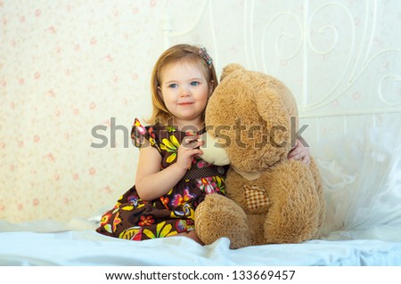 A girl plays with a toy