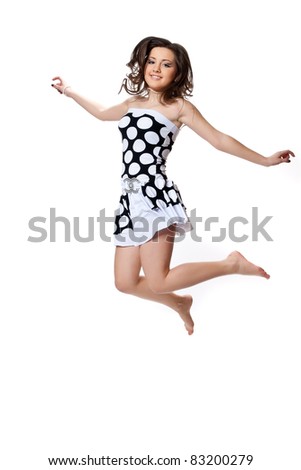 Dancing in black and white polka dot dress isolated on a white background