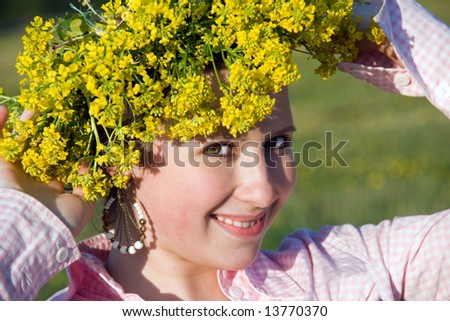 Portrait of summer girl in flowers diadem