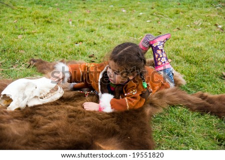 child of the chukchi playing with skull of the bear