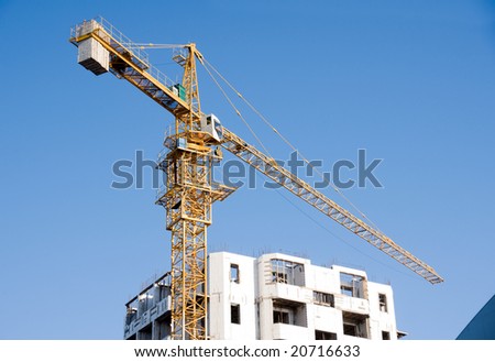 lifting crane on building of the new house