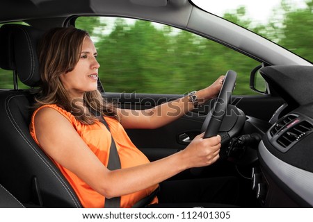 Pregnant Woman Driving Car Through the Woods