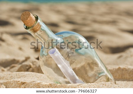 Lost message inside a bottle ashored at the beach and is waiting for someone to find it