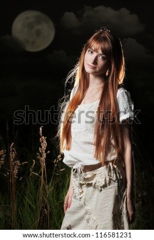 Beautiful woman under full moon