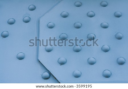 Background of blue painted metal construction