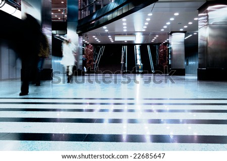 Subway station with train in motion. Motion blur. Blue tint