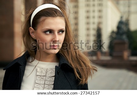 Portrait of beautiful woman with a retro hairdo and hair band