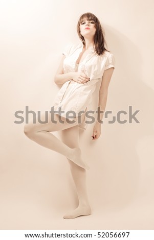 stock photo Young beautiful women in white pantyhose with stage makeup 