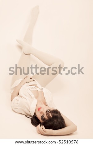stock photo Young beautiful women in white pantyhose with stage makeup 
