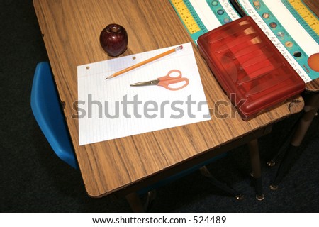 student supplied with scissors, pencil, paper their first day back to school