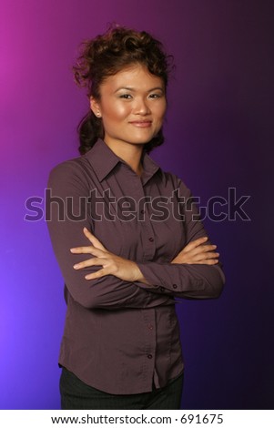 pose of a Japanese girl on blue and purple backdrop