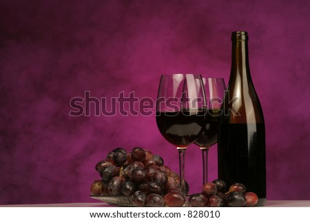 Horizontal of Wine bottle with glasses and grapes on purple background