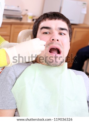 A man is afraid to treat teeth