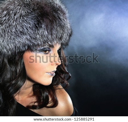 Fur fashion face with luxury makeup .  Winter Woman Portrait .