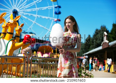 beautiful woman with candy floss in the park
