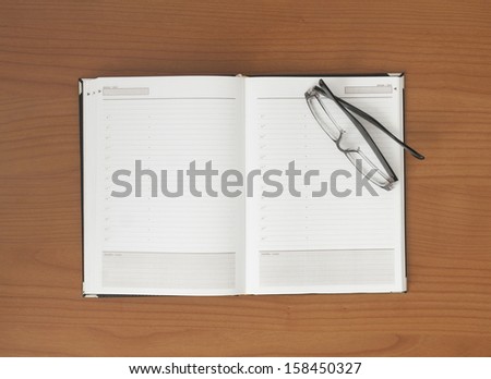 Business background, notes and glases on table