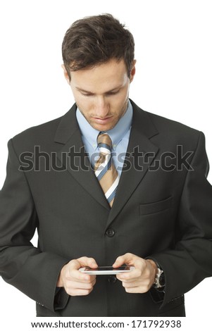Handsome businessman checking emails on the phone
