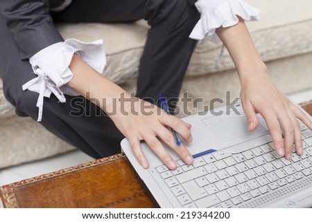 Businesswoman with laptop computer surfing the net