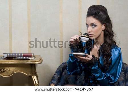 Stylized baroque portrait of woman and time for tea