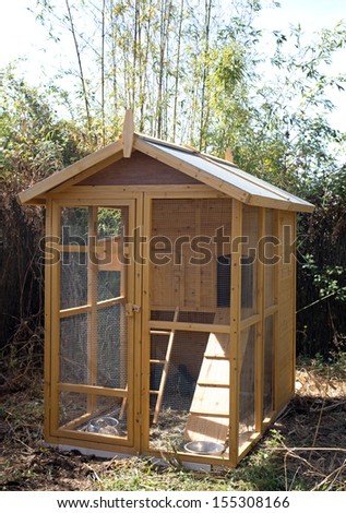 wooden hen house in a little garden