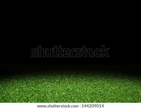 Green grass field with spotlight Green grass field with spotlight