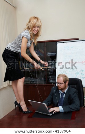 Sexy Lady manipulates a Boss as a marionette. Office scene.