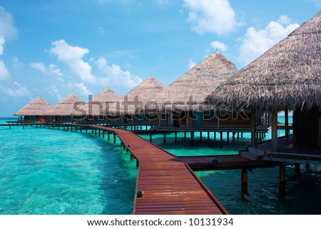 Water Villas in The Ocean. Welcome to island of Paradise! Maldives. High contrast.