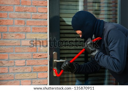 Burglar carrying the tool of choice